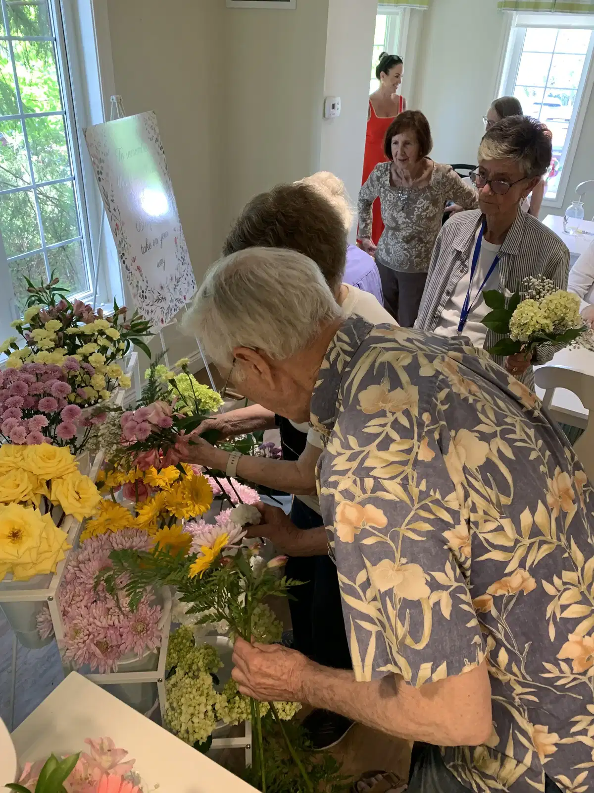 Hands on creating with beautiful blooms.